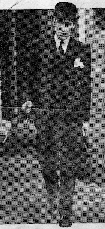 Les Burgess suited booted